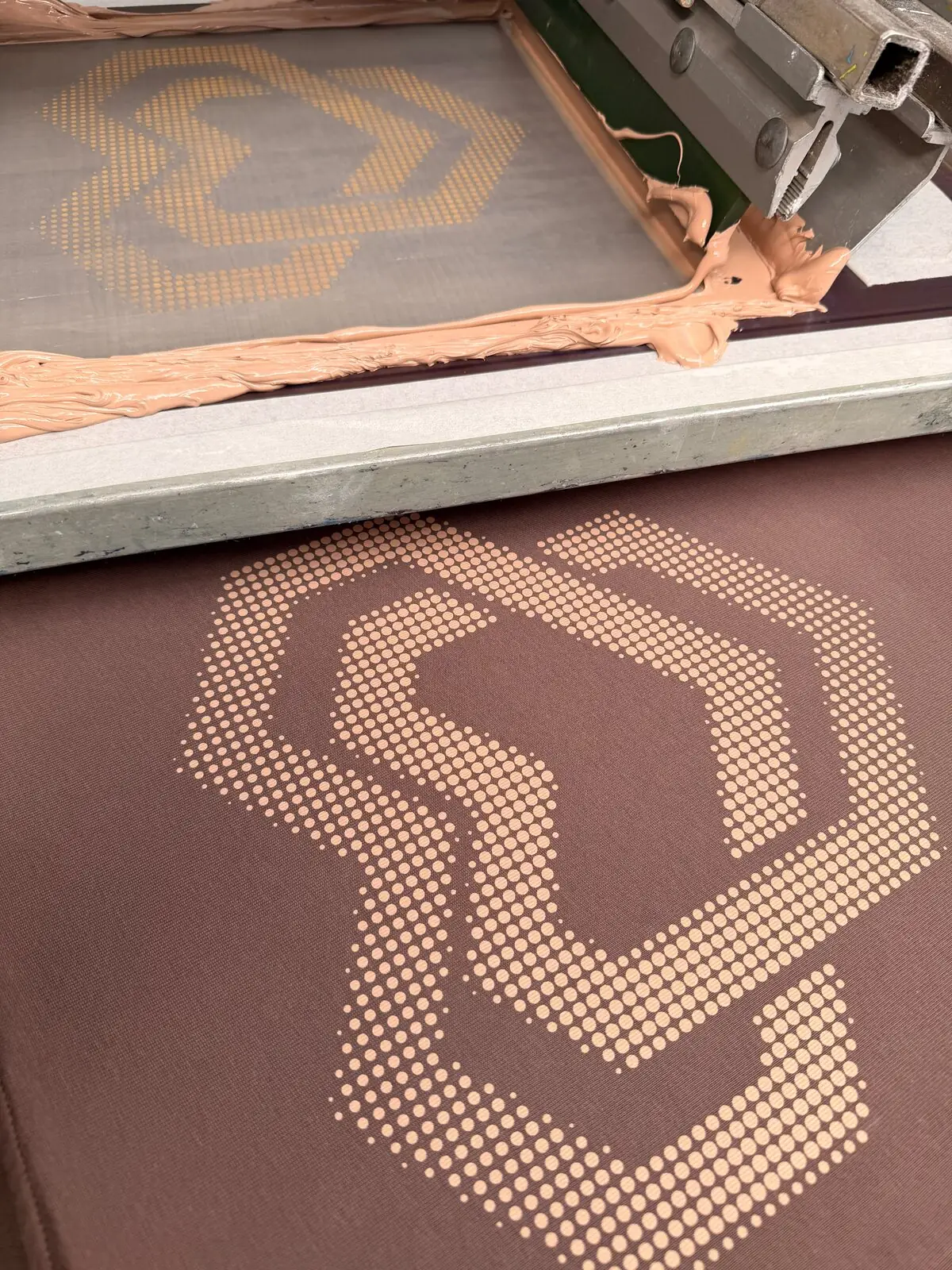 Screen with the brand colour, the printed halftone heart below